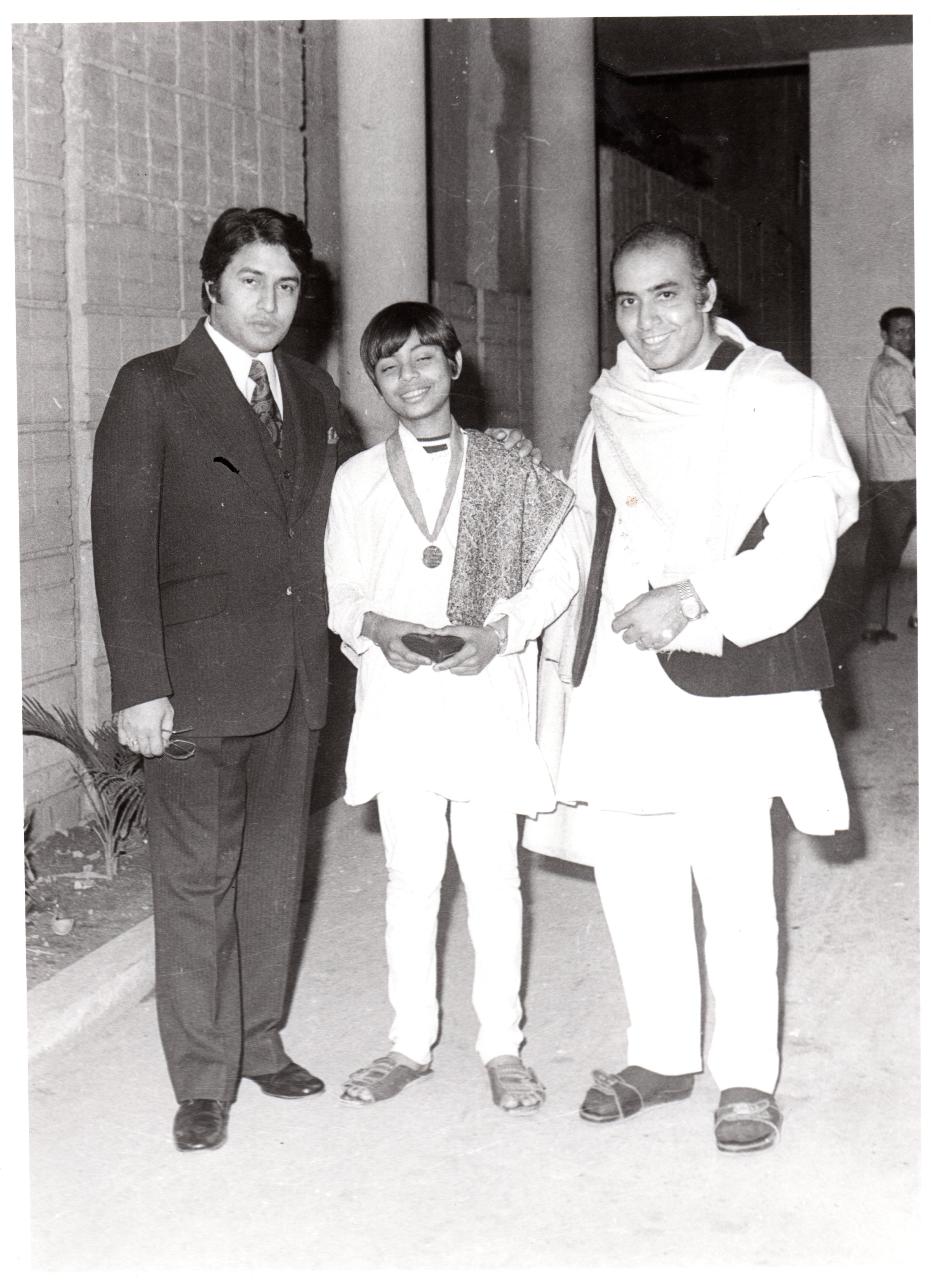 1973 with father receiving gold medal from Ustad Amjad Ali Khan